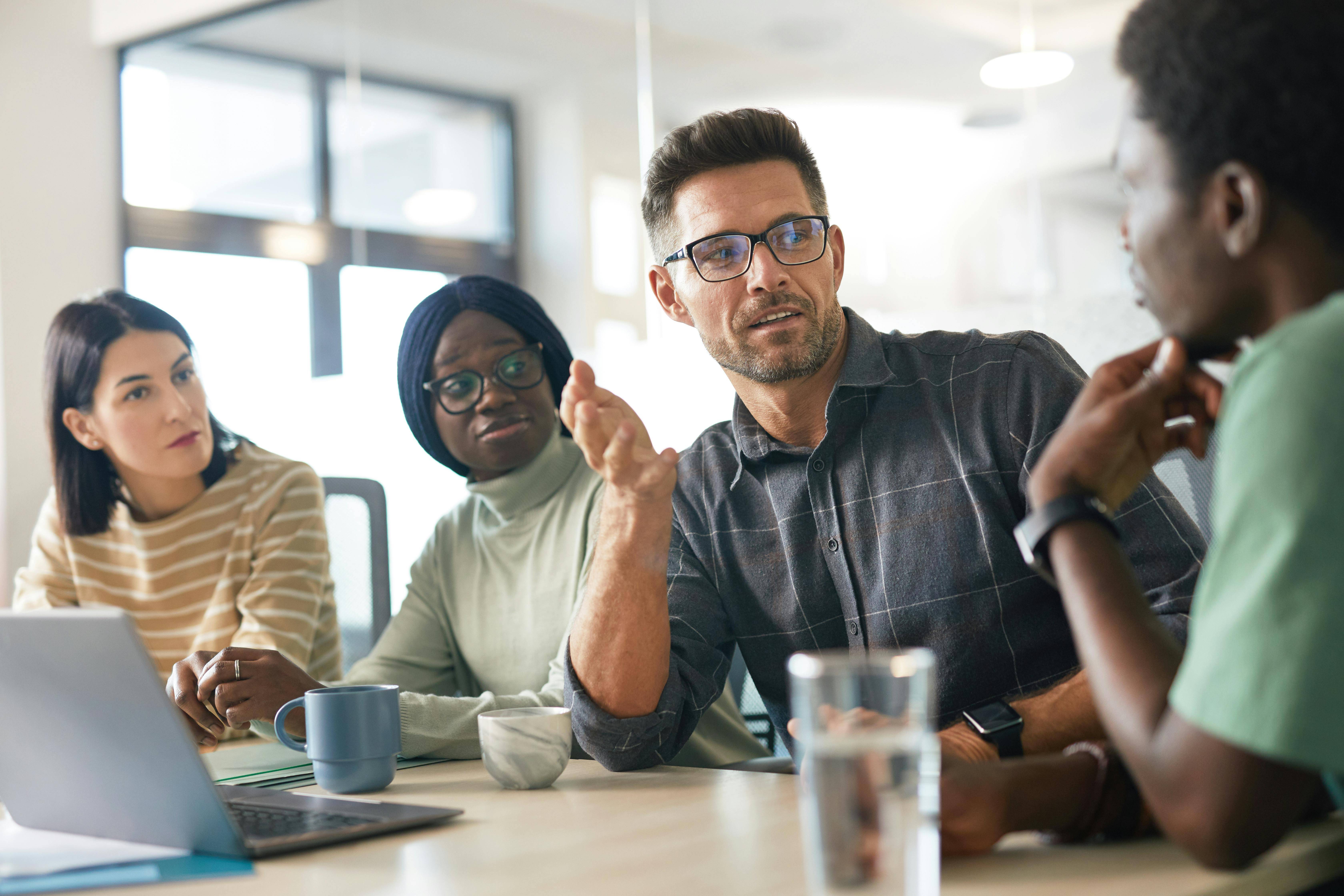 group of diverse employees having a meeting in an office