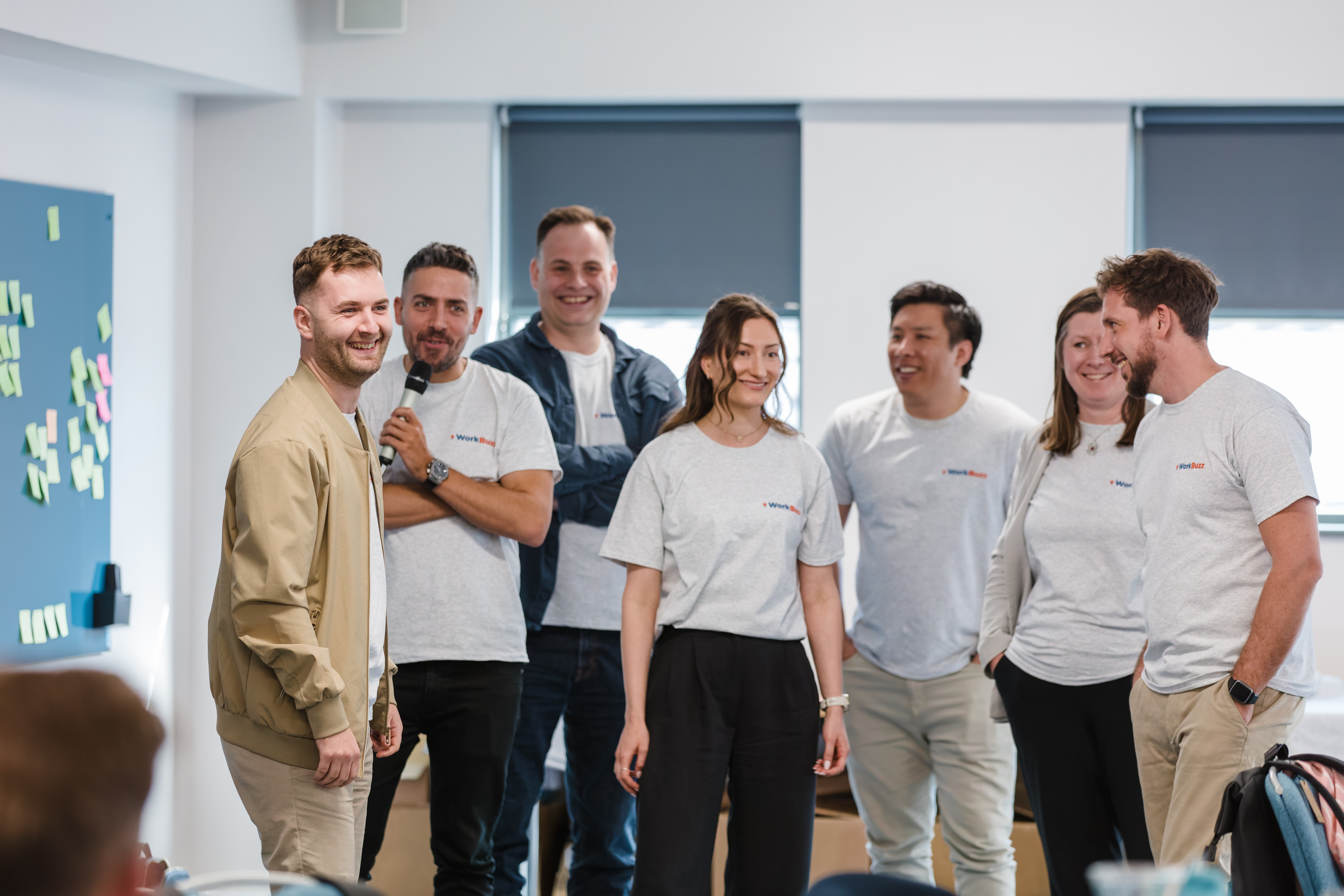 Photo of WorkBuzz team speaking at an event